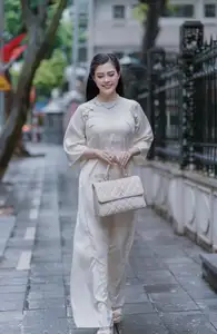 VGU No.162: Modern Ao Dai Grace: Vietnamese Woman's Elegant Style & Allure on City Streets.-3