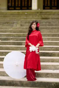 Graceful Vietnamese Beauty: Traditional Ao Dai Adorned with a Vibrant Red Flower-8