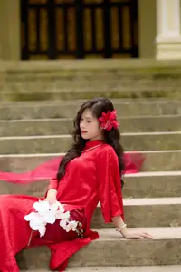 Graceful Vietnamese Beauty: Traditional Ao Dai Adorned with a Vibrant Red Flower-7