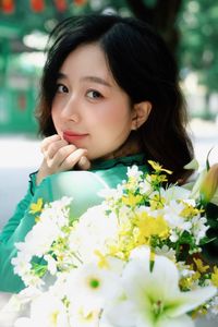 Captivating Smile: Young Woman in Green Embraces Nature's Serenity 1000019864-5