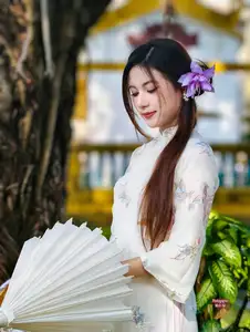 Graceful Ao Dai: Explore the Timeless Traditional Beauty of a Vietnamese Girl with an Elegant Parasol in a Lush Garden Setting-3