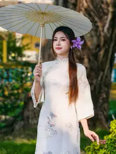 Graceful Ao Dai: Explore the Timeless Traditional Beauty of a Vietnamese Girl with an Elegant Parasol in a Lush Garden Setting-0
