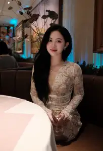 Captivating Beauty: Young Woman in Elegant Lace Dress Shines in Luxurious Restaurant Setting.-0