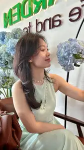 Asian Grace: Vietnamese Woman's Radiant Smile & Elegant Tea Moment-5