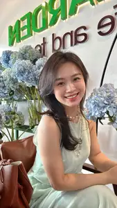 Asian Grace: Vietnamese Woman's Radiant Smile & Elegant Tea Moment-8