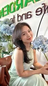 Asian Grace: Vietnamese Woman's Radiant Smile & Elegant Tea Moment-6