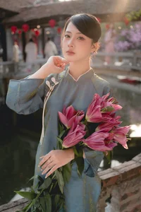 Classic Elegance: Vietnamese Tradition in Blue Silk and Pink Lilies-2