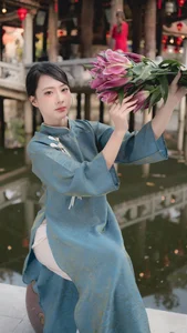 Classic Elegance: Vietnamese Tradition in Blue Silk and Pink Lilies-5