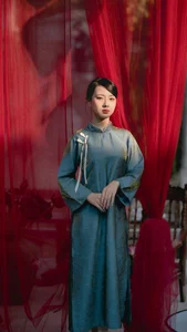 Classic Elegance: Vietnamese Tradition in Blue Silk and Pink Lilies-9