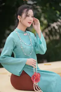 Captivating Charm: Vietnamese Girl's Elegance in a Stunning Mint Green Ao Dai-9