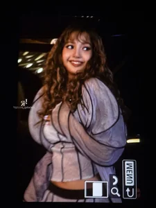 Lisa of Blackpink stuns with bold hippie curls at an international fashion event-8