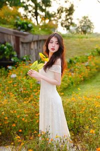 XVG No.2: Serene Beauty A Vietnamese Girl Amidst a Vibrant Flower Garden-9