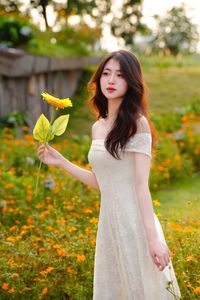 XVG No.2: Serene Beauty A Vietnamese Girl Amidst a Vibrant Flower Garden-8