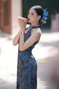 Captivating Asian Beauty: Elegant Woman in Blue Cheongsam with Traditional Fan-1