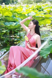 Elegant Vietnamese Girl in Pink Ao Yem by Lotus Pond, Capturing Traditional Beauty and Serenity-5