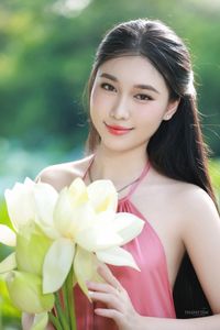 Elegant Vietnamese Girl in Pink Ao Yem by Lotus Pond, Capturing Traditional Beauty and Serenity-11
