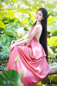 Elegant Vietnamese Girl in Pink Ao Yem by Lotus Pond, Capturing Traditional Beauty and Serenity-3