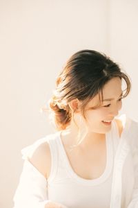 Captivating Female Portrait Bathed in Radiant Morning Sunlight, Embracing Natural Beauty 1000018680-5