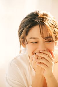 Captivating Female Portrait Bathed in Radiant Morning Sunlight, Embracing Natural Beauty 1000018680-3