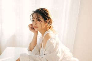 Captivating Female Portrait Bathed in Radiant Morning Sunlight, Embracing Natural Beauty 1000018680-1