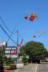 Vibrant Tet Traditions: Discover the Colorful Lunar New Year Bamboo Poles (Cay Neu) Along the Scenic Roads of Gia Lai, Vietnam-1