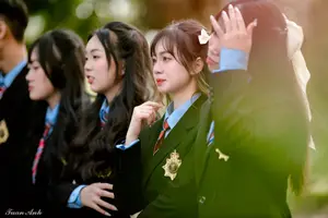 Graceful Vietnamese Girl in Elegant White Ao Dai with Sweet Finger Heart Gesture-6