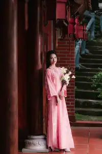 Pink Ao Dai Charm: Discover the Ethereal Beauty of Vietnamese Women in Ancient Heritage Settings.-5