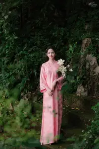 Pink Ao Dai Charm: Discover the Ethereal Beauty of Vietnamese Women in Ancient Heritage Settings.-6