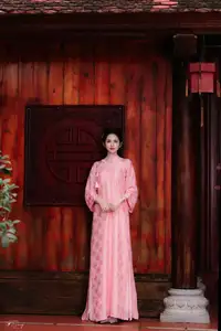 Pink Ao Dai Charm: Discover the Ethereal Beauty of Vietnamese Women in Ancient Heritage Settings.-7