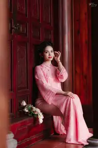 Pink Ao Dai Charm: Discover the Ethereal Beauty of Vietnamese Women in Ancient Heritage Settings.-1