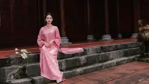 Pink Ao Dai Charm: Discover the Ethereal Beauty of Vietnamese Women in Ancient Heritage Settings.-10
