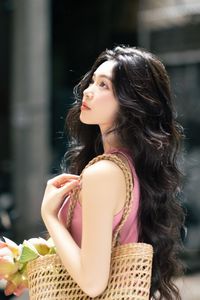 Vietnamese Grace: Elegant Girl in Traditional Flower Market, Discover Vibrant Culture 1000019476-4