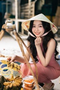 Vietnamese Grace: Elegant Girl in Traditional Flower Market, Discover Vibrant Culture 1000019476-1