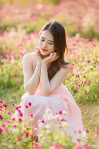 Serene Beauty: Young Woman in Pink Dress Amidst a Vibrant Flower Field-5