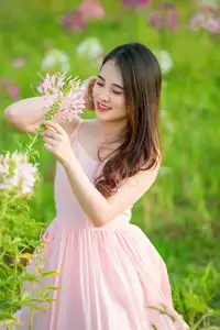 Serene Beauty: Young Woman in Pink Dress Amidst a Vibrant Flower Field-2
