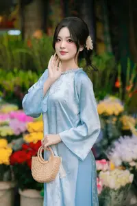 Traditional Vietnamese Beauty: Graceful Girl in Blue Ao Dai with Fresh Flowers-8