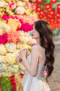 Radiant Vietnamese Girl Amidst a Sea of Vibrant Flowers-2