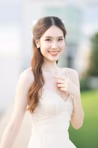 XVG No.19: Radiant Bride: Beautiful Woman in Elegant White Gown with a Joyful Smile in Lush Green Setting.-15
