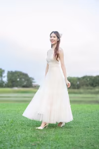 XVG No.19: Radiant Bride: Beautiful Woman in Elegant White Gown with a Joyful Smile in Lush Green Setting.-6