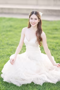 XVG No.19: Radiant Bride: Beautiful Woman in Elegant White Gown with a Joyful Smile in Lush Green Setting.-17