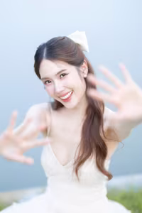 XVG No.19: Radiant Bride: Beautiful Woman in Elegant White Gown with a Joyful Smile in Lush Green Setting.-3
