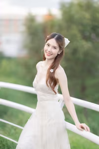 XVG No.19: Radiant Bride: Beautiful Woman in Elegant White Gown with a Joyful Smile in Lush Green Setting.-10