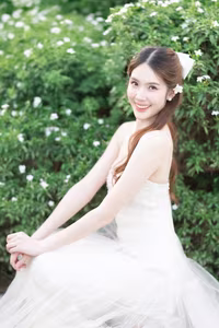 XVG No.19: Radiant Bride: Beautiful Woman in Elegant White Gown with a Joyful Smile in Lush Green Setting.-20