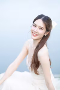 XVG No.19: Radiant Bride: Beautiful Woman in Elegant White Gown with a Joyful Smile in Lush Green Setting.-0