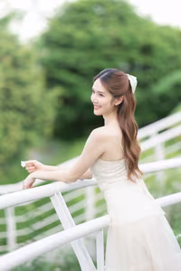 XVG No.19: Radiant Bride: Beautiful Woman in Elegant White Gown with a Joyful Smile in Lush Green Setting.-7