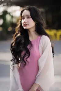 Captivating Grace: Long-Haired Beauty in Soft Pink Evokes Dreamy Serenity.-0