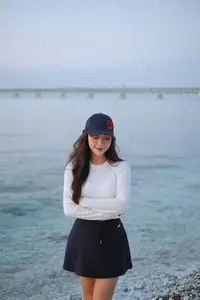 Dreamy Sunset by the Sea: Young Woman Relaxing and Gazing-6