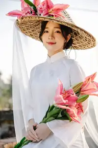 Discover the captivating grace of a Vietnamese woman in a flowing white Ao Dai and traditional conical hat-7