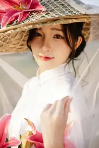 Discover the captivating grace of a Vietnamese woman in a flowing white Ao Dai and traditional conical hat-17