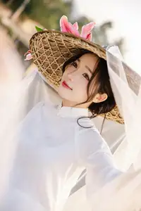Discover the captivating grace of a Vietnamese woman in a flowing white Ao Dai and traditional conical hat-1